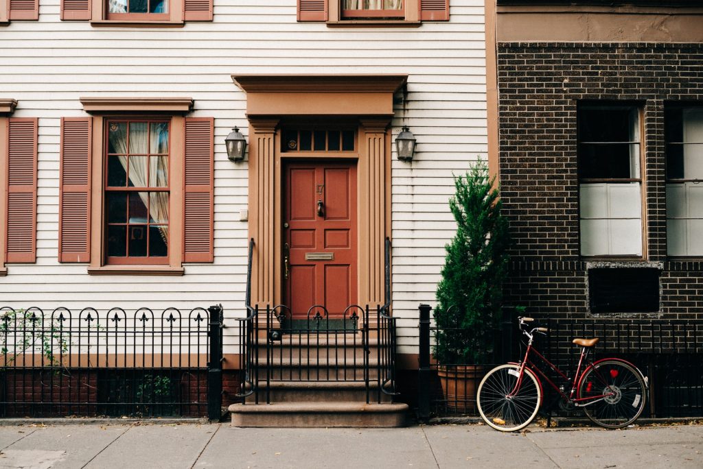 apartment front door and red bike