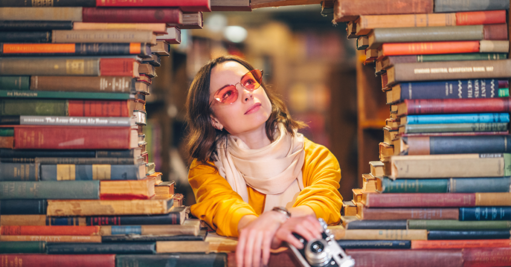 woman in center of books